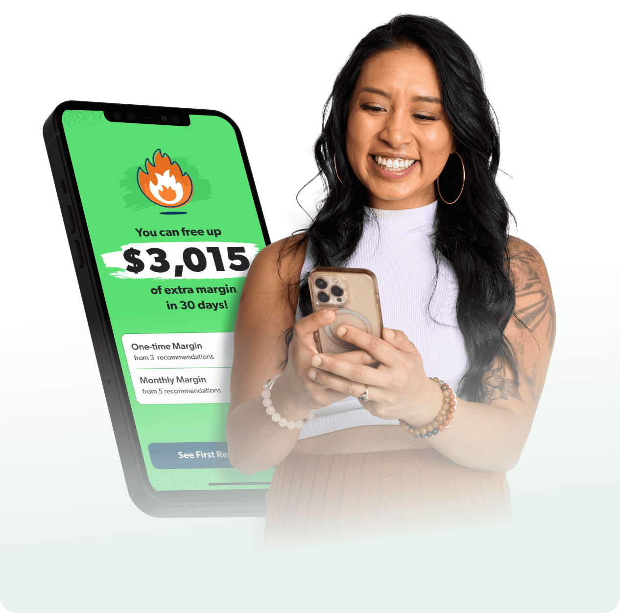 Smiling woman looking at her phone with a large EveryDollar app screen behind her showing “You can free up $3,015 of extra margin in 30 days.”